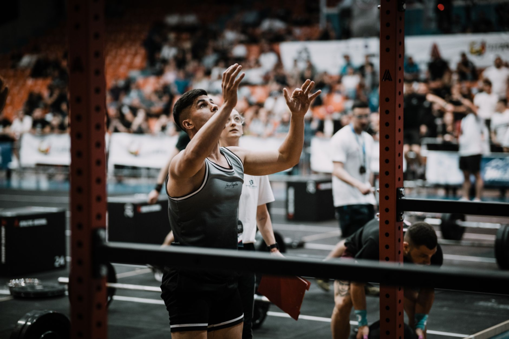An action shot of a contestant in the Las Vegas burger heat challenge, showcasing their determination. — spicy burgers L…