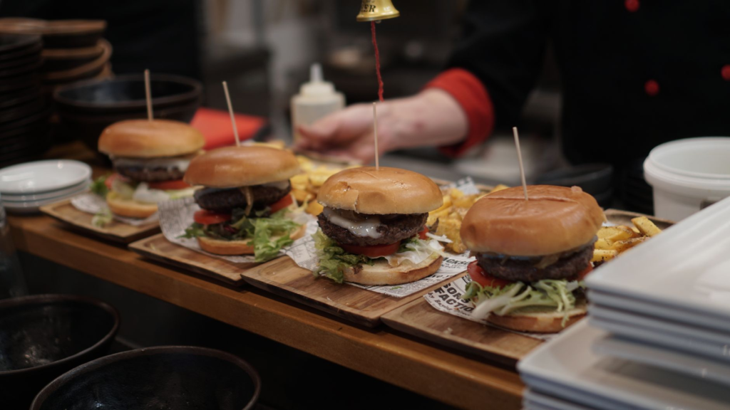 An array of burgers from different Las Vegas restaurants on a table, showcasing the best burgers in Las Vegas.