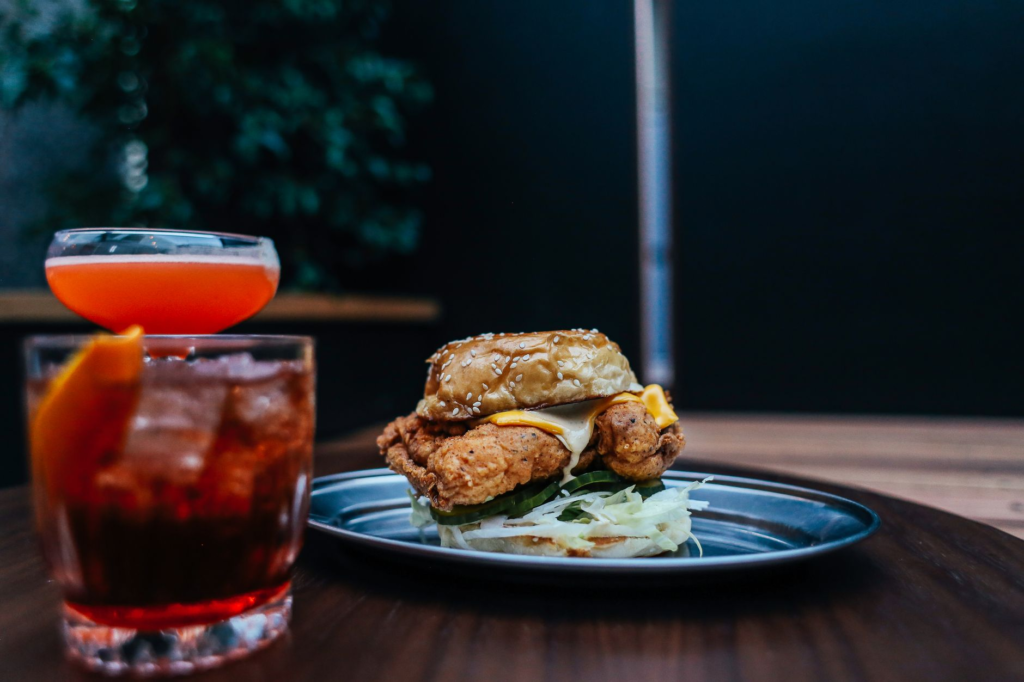 An array of colorful cocktails paired with gourmet burgers at a Las Vegas restaurant. — burger and drink pairings Las Vegas