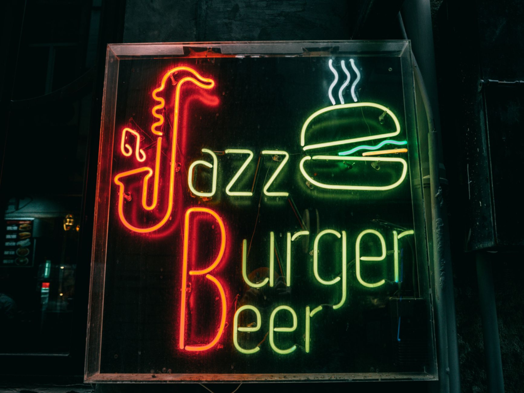An exterior shot of Burger Bar highlighting its vibrant sign — juiciest burgers Las Vegas Strip