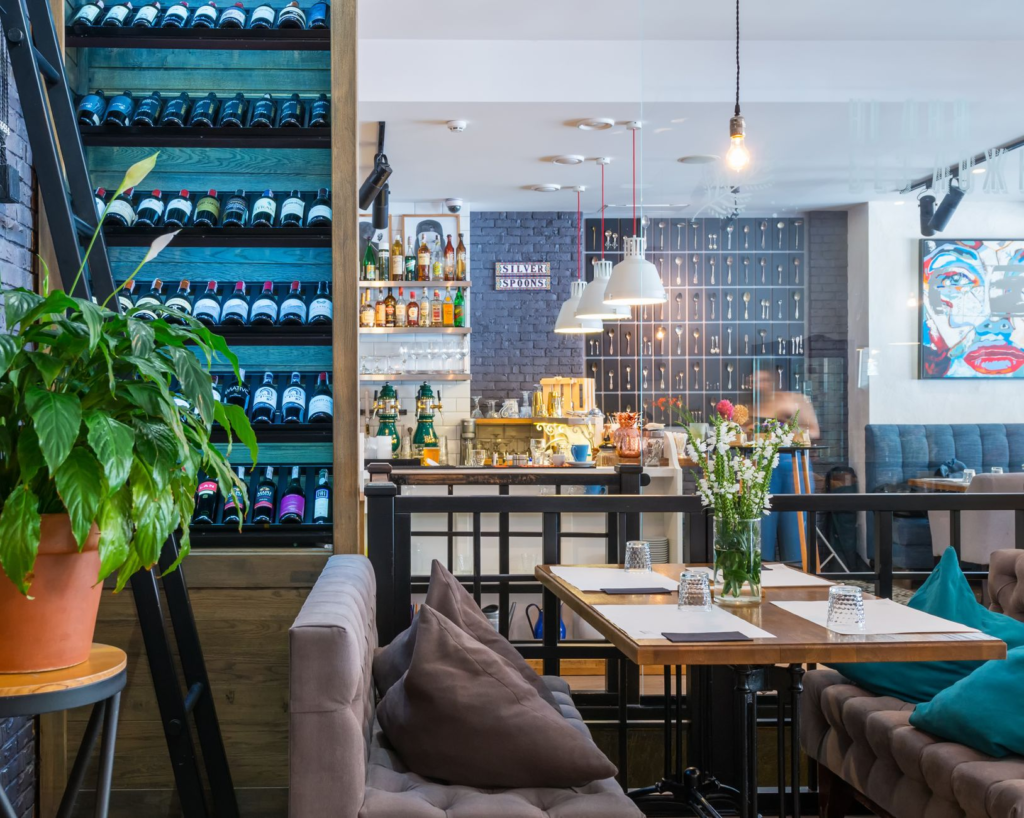 An inviting interior shot of a trendy vegan restaurant in Las Vegas, showcasing its menu and ambiance. — vegan burgers L…