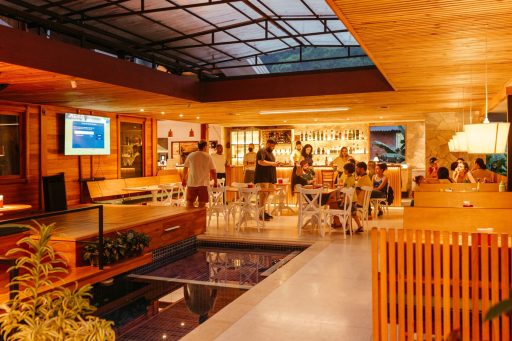 An inviting outdoor seating area of a vegan restaurant in Las Vegas, with patrons enjoying their meals. — vegan burgers …