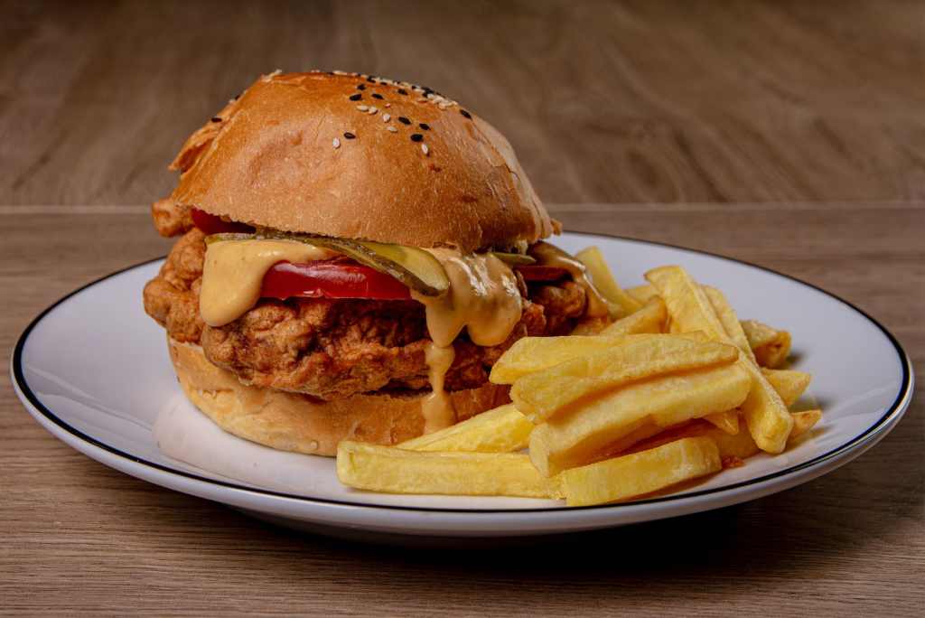 An inviting restaurant setting showcasing diners enjoying chicken burgers las vegas.
