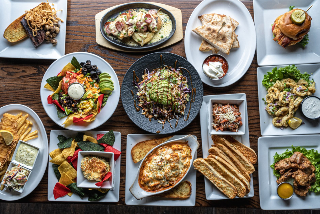 An overhead shot of a variety of unique burgers, highlighting their creative presentations. — unique burgers Las Vegas