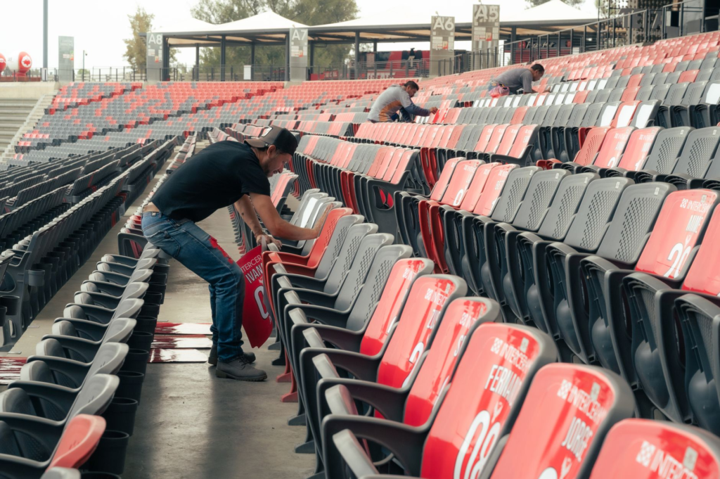 An overview of Allegiant Stadium with fans enjoying pre-game food in the foreground. — burgers near allegiant stadium