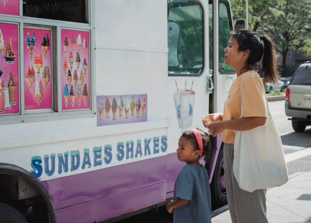 Families enjoying a summer event in Las Vegas, surrounded by food trucks and live music. — Las Vegas burger festival 2026