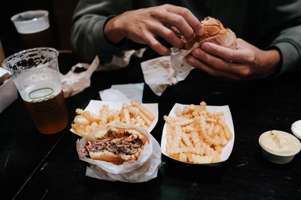 The iconic Shake Shack burger and fries in a casual dining setup. — burger joints Las Vegas Strip