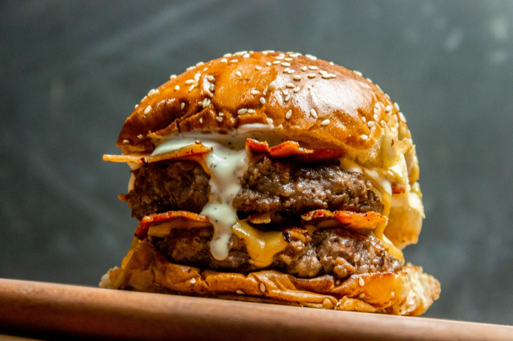 A BBQ bacon burger stacked high with crispy bacon and BBQ sauce. — best burgers in Las Vegas