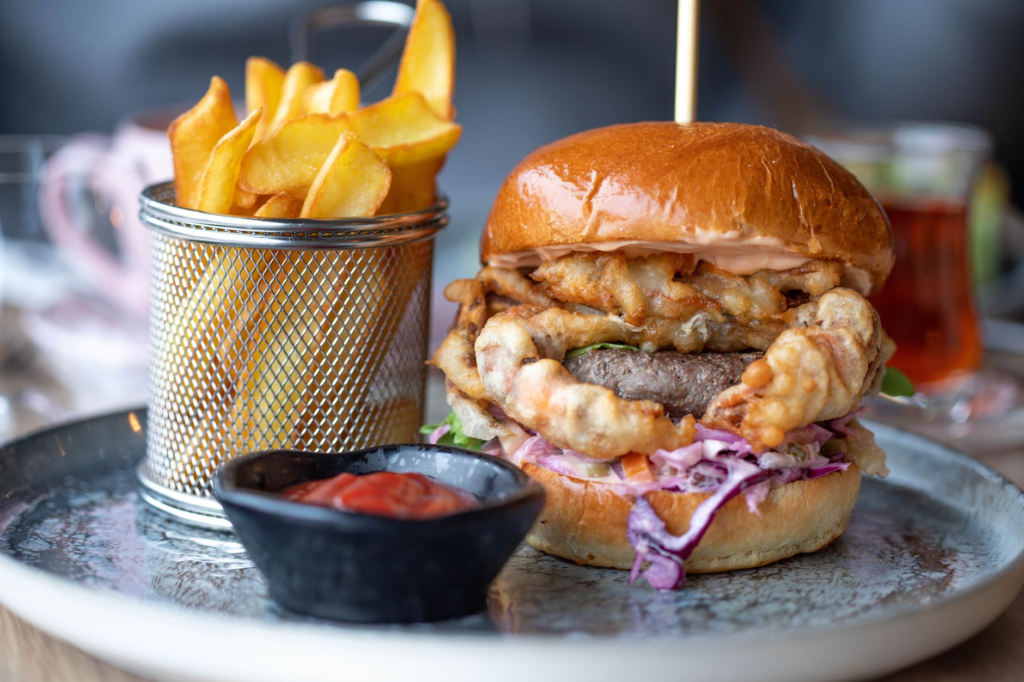 A beautifully presented gourmet burger from Gordon Ramsay Burger with a side of fries. — romantic restaurants las vegas