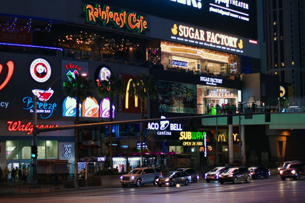 A bustling Las Vegas burger joint filled with happy diners enjoying local favorites in the Las Vegas burger chains vs locals debate