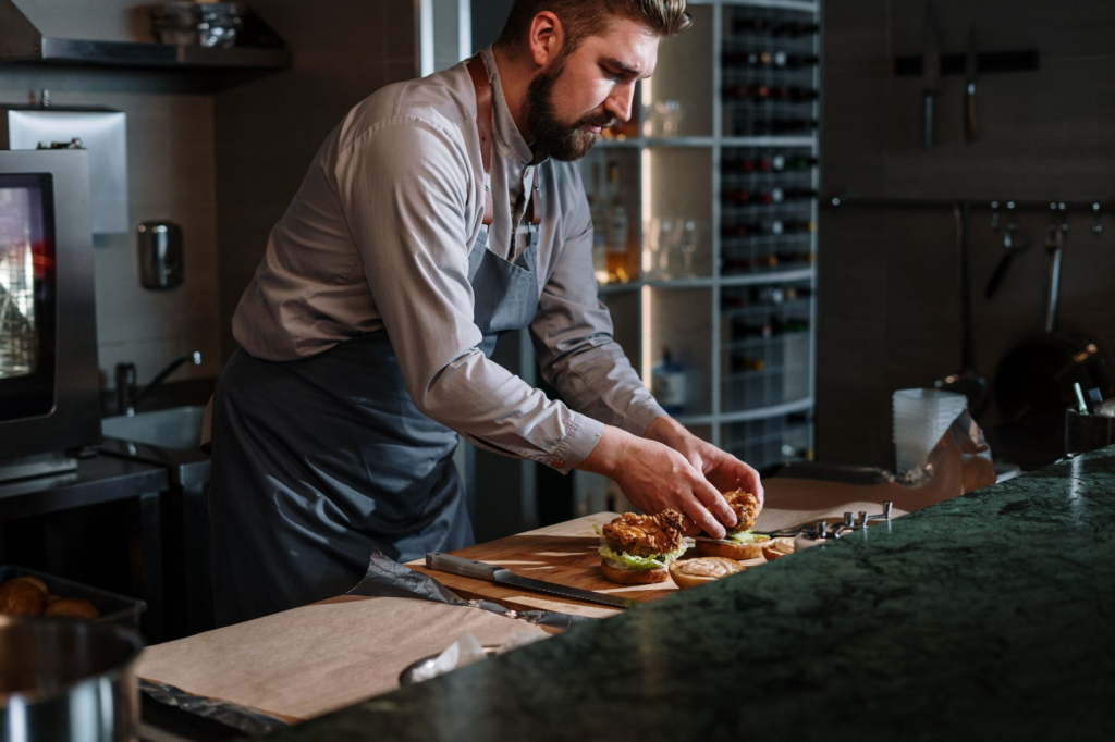 A chef preparing a vegetarian burger in a trendy kitchen. — vegetarian burgers Las Vegas