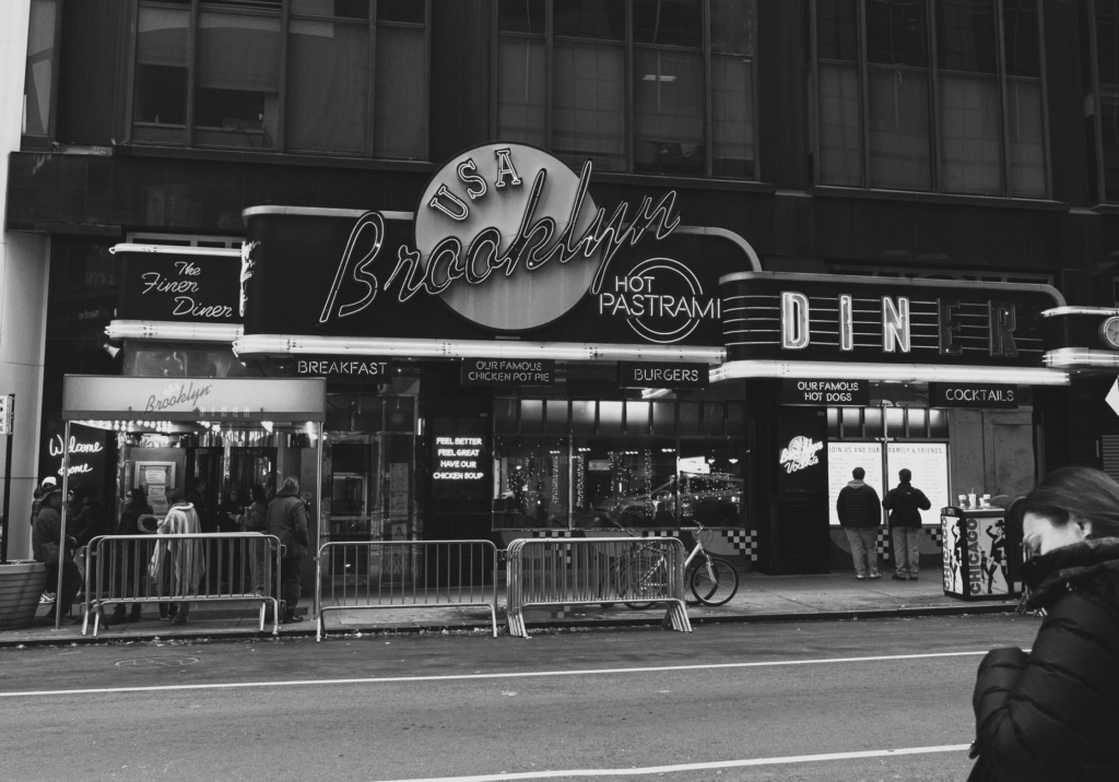 A classic diner setting with neon lights showcasing a variety of burgers. — las vegas food guide