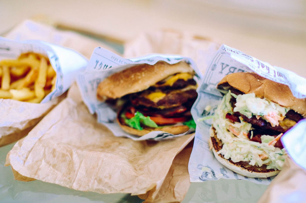 A close-up of a juicy burger with fries, highlighting the value of combo deals. — cheap burgers Las Vegas