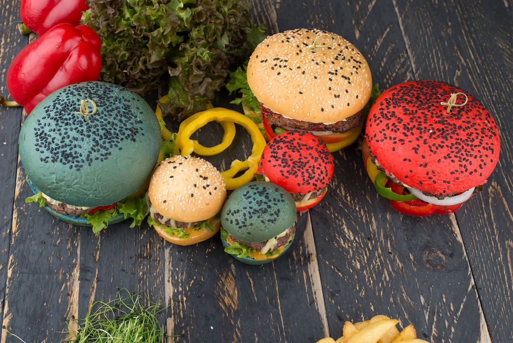 A colorful array of different burgers on a table at a Las Vegas restaurant showcasing the best burgers in Las Vegas.