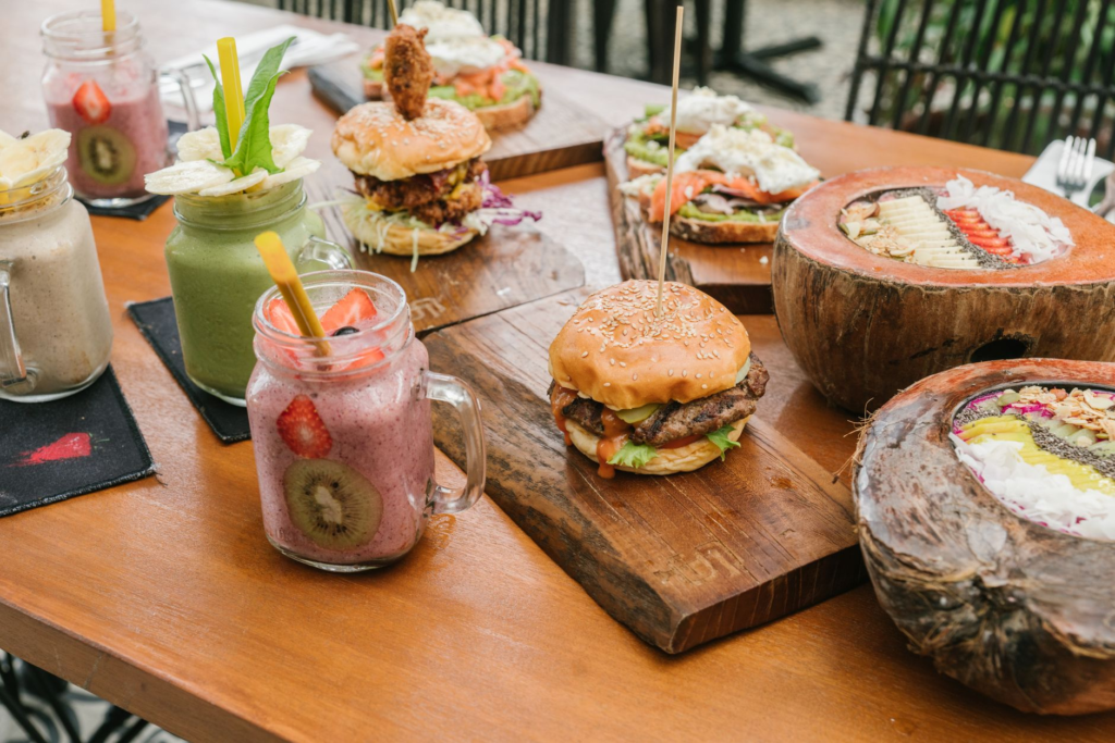 A colorful array of vegetarian burgers from Vegenation on a wooden table. — best vegetarian burgers Las Vegas
