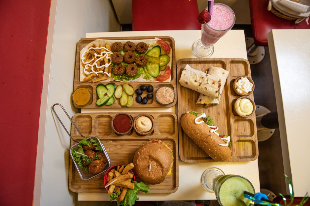 A colorful plate of family-friendly burgers with fries and a milkshake. — family-friendly burgers Las Vegas