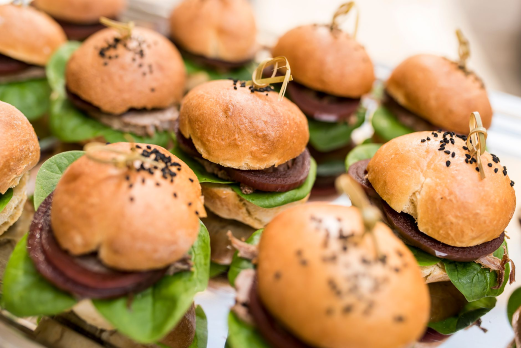 A colorful platter of burgers showcasing various unique burger toppings in Las Vegas. — burger toppings Las Vegas