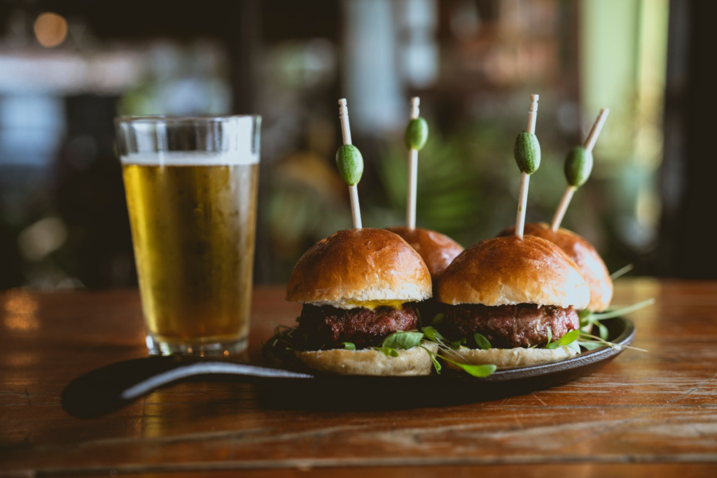 A colorful platter showcasing various burgers paired with different beer styles. — burger beer pairings Las Vegas