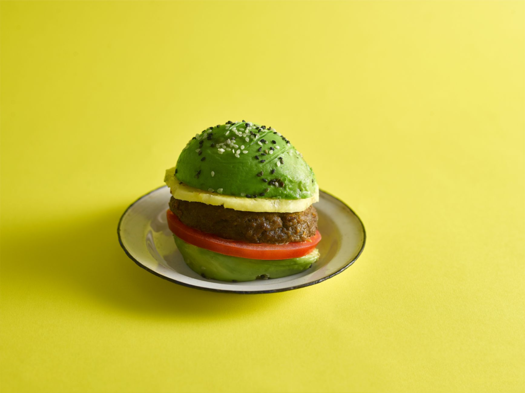 A creative burger with plant-based toppings, featuring avocado, sprouts, and a special sauce. — best burger toppings
