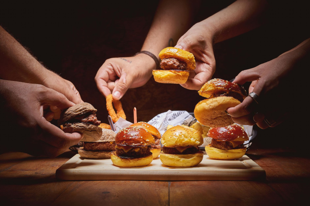 A delicious dessert designed for sharing, placed next to a couple's burgers. — romantic restaurants las vegas