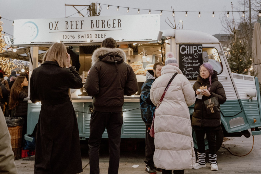 A food festival scene with vendors showcasing various vegan burger options to attendees. — vegan burgers Las Vegas