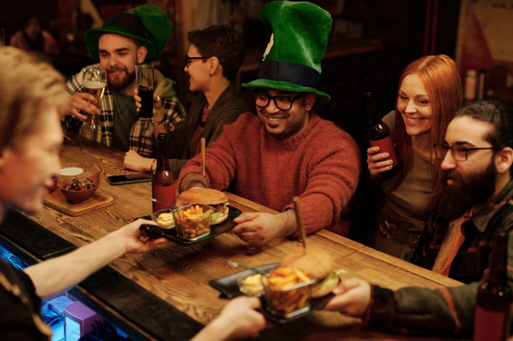 A group of friends enjoying spicy burgers at a trendy Las Vegas restaurant, smiling and celebrating. — spicy burgers Las…