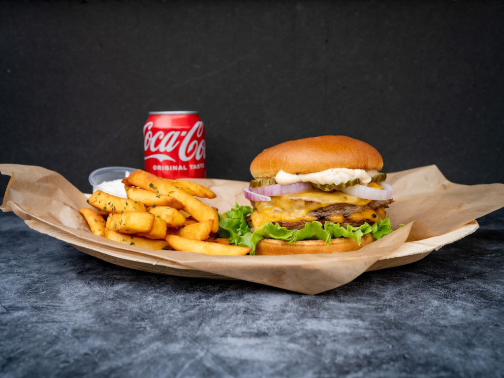 A mouth-watering cheeseburger paired with a light lager. — burger beer pairings Las Vegas
