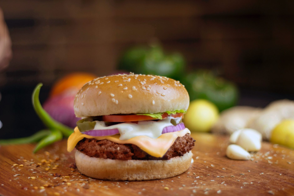 A mouth-watering vegan burger with fresh toppings on a wooden table — vegan burgers Las Vegas