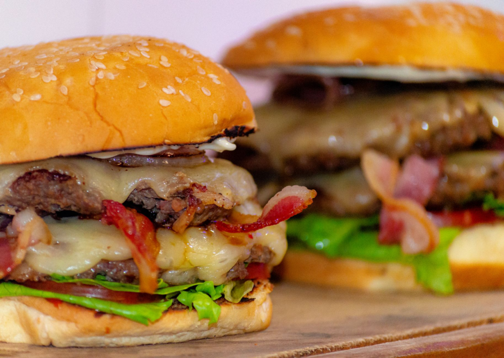 A mouthwatering burger from a Las Vegas food festival, showcasing fresh ingredients and vibrant colors. — burger festiva…