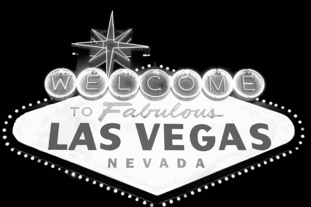 A neon-lit sign of a famous burger restaurant on the Las Vegas Strip at night. — best burgers Las Vegas Strip