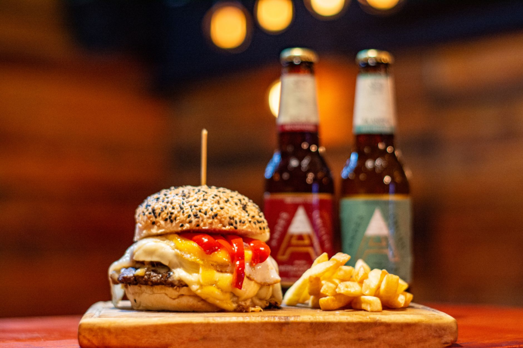 A selection of craft beers and wines paired with a gourmet burger meal. — gourmet burgers Las Vegas