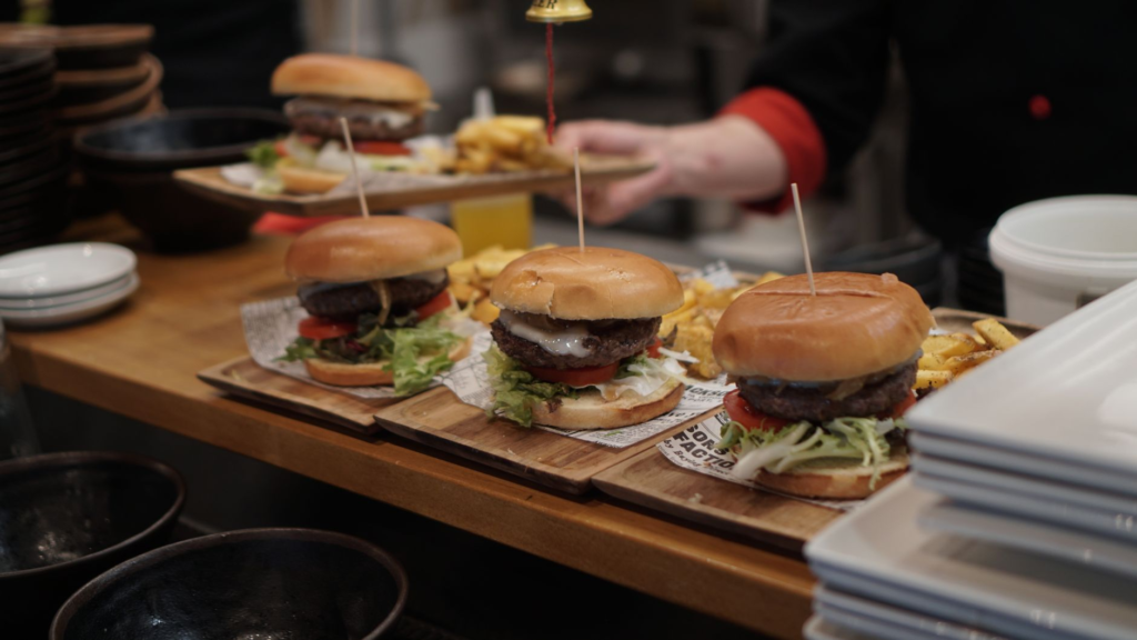 A selection of gourmet burgers served with unique side dishes. — gourmet burgers Las Vegas