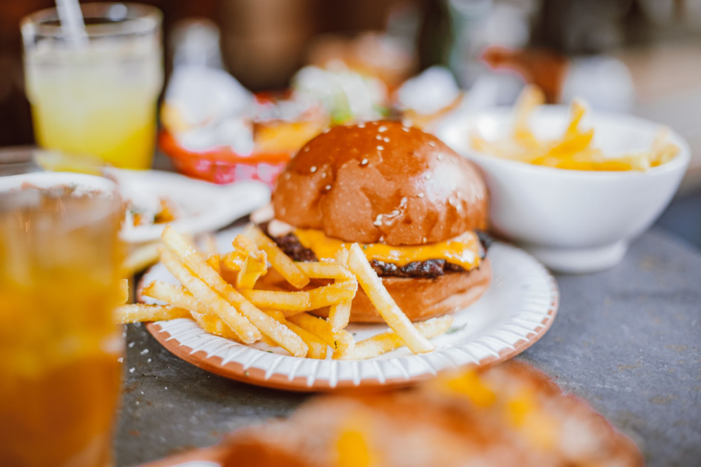 A vibrant plate of fries and a shake accompanying a classic Las Vegas burger. — las vegas burger faq