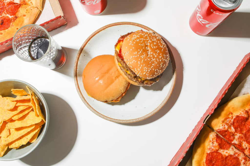 A vibrant plate of homemade smash burgers with toppings — smash burger vs regular burger