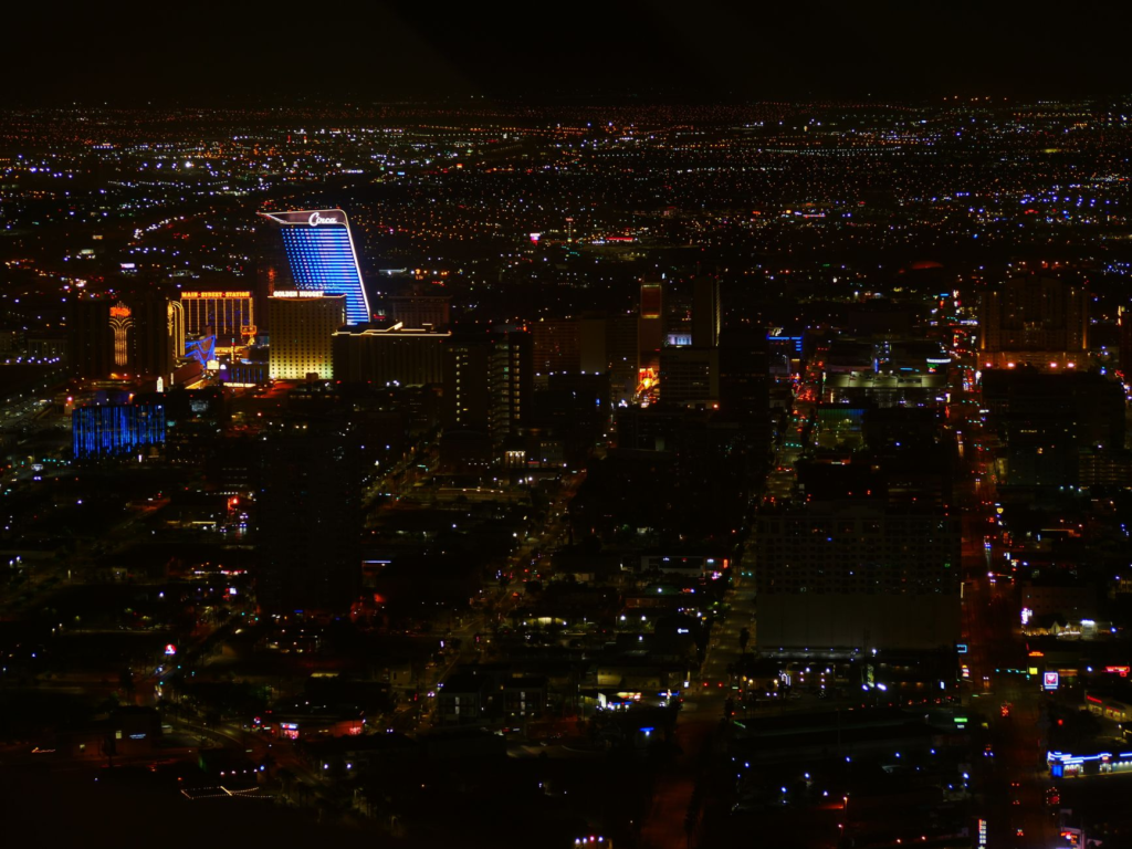 An aerial view of Las Vegas at night, showcasing its vibrant dining scene. — romantic restaurants las vegas