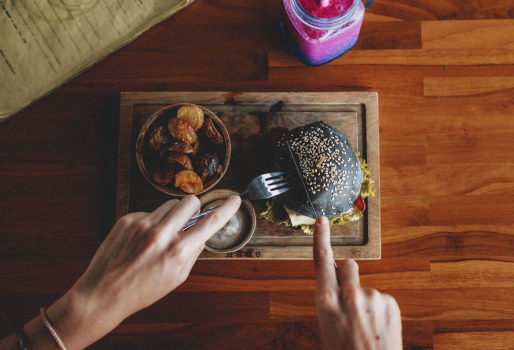 An appetizing gourmet burger with unique toppings served in a trendy Las Vegas restaurant. — burger chains Las Vegas