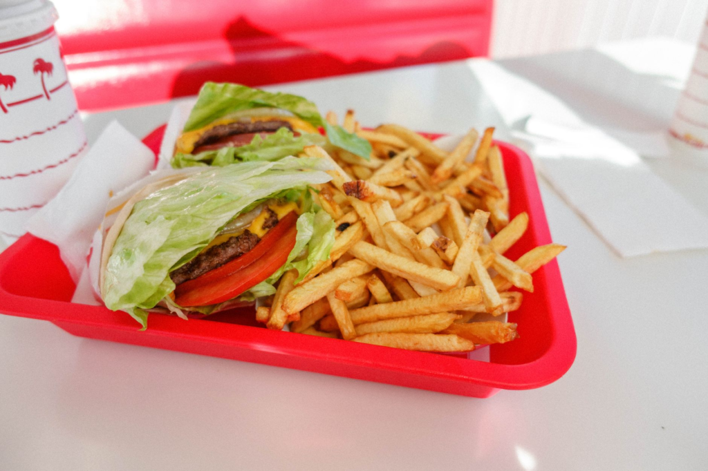 An image of an In-N-Out burger with fries, highlighting its fresh ingredients. — in n out vs vegas burgers