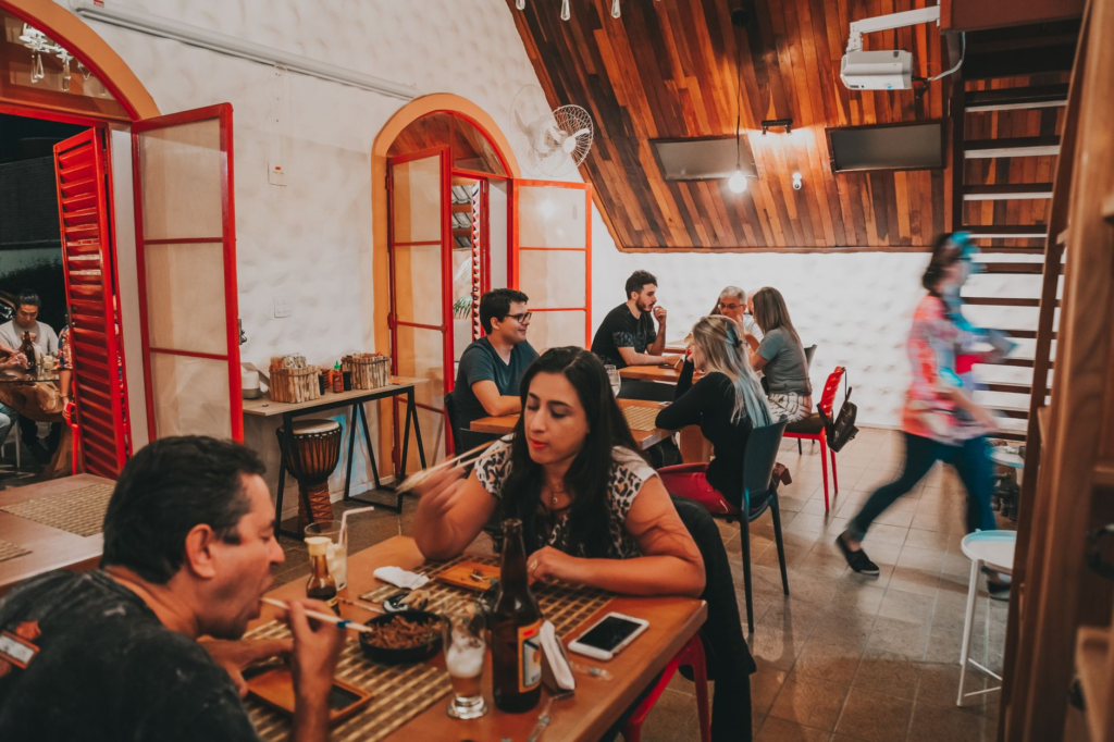 An interior shot of a cozy restaurant known for affordable dining, with patrons enjoying their meals. — cheap burgers La…