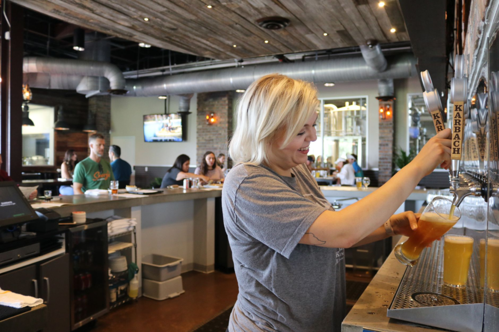 An interior shot of a popular Las Vegas brewery with patrons enjoying burgers and beers. — burger beer pairings Las Vegas