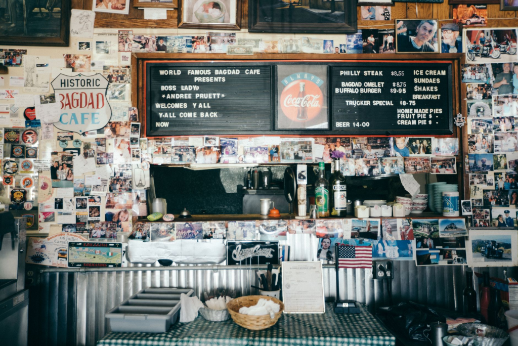 Interior shot of a cozy local burger spot filled with happy diners. — hidden gem burgers Las Vegas