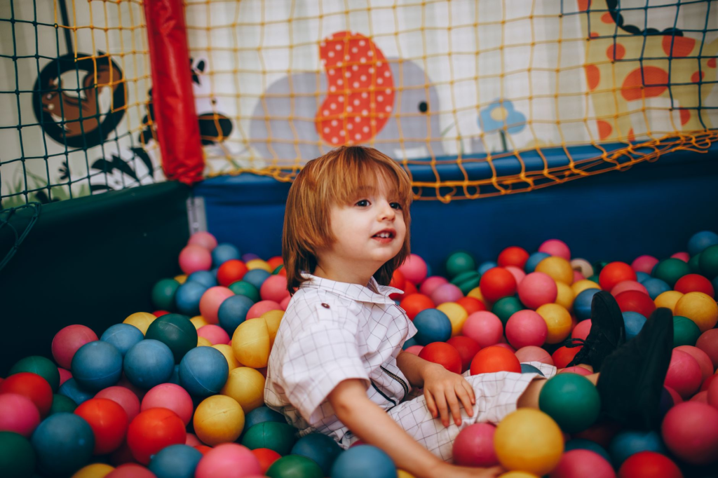 Kids playing in the designated play area of a burger restaurant. — family-friendly burgers Las Vegas