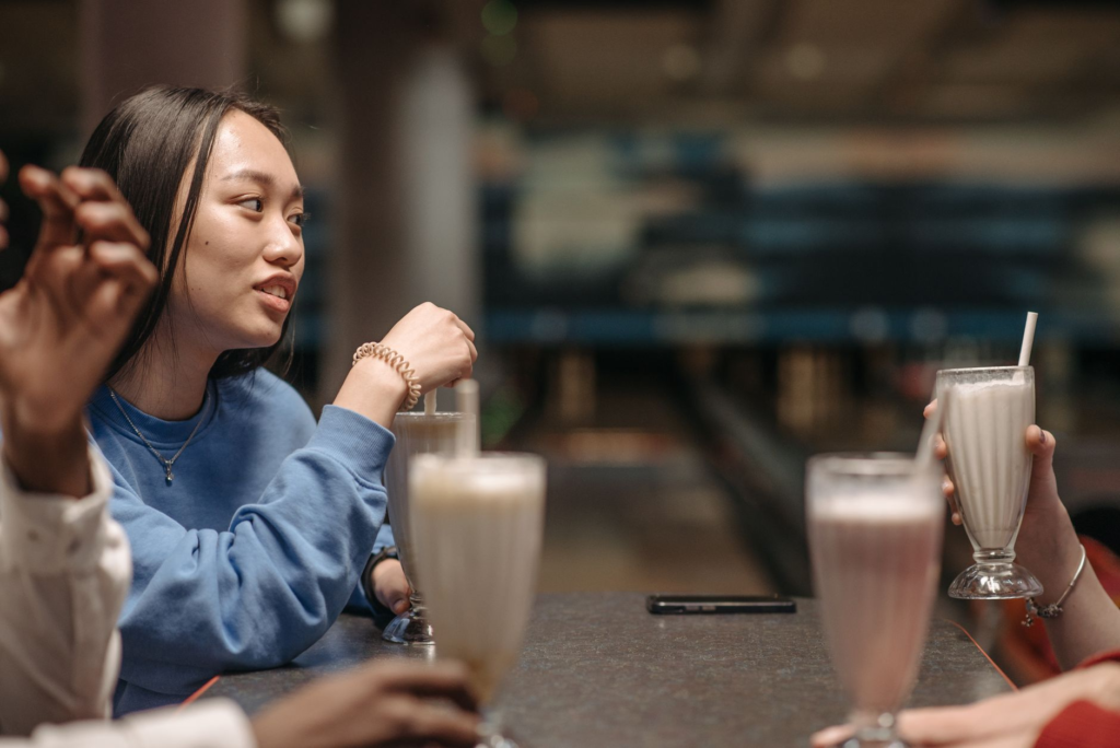 A group of friends enjoying burgers and milkshakes late at night — late night burgers Las Vegas