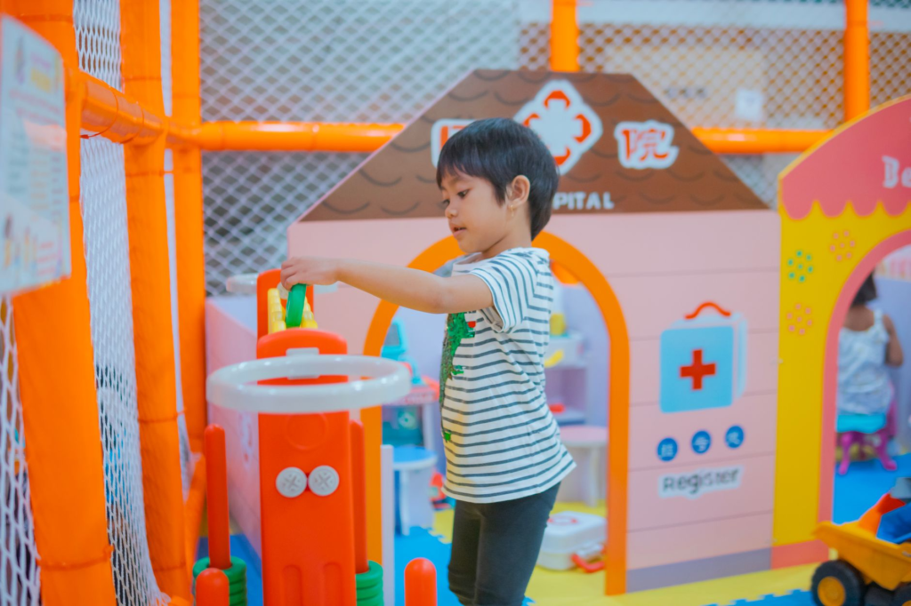Children playing in a designated play area at a burger restaurant in Las Vegas, highlighting kid-friendly features. — fa…